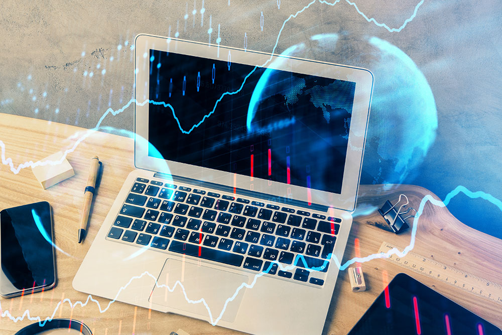 Apple Inc. products like laptop, ipad, and smartphone place on a wooden table, overlaid a stock market graph and a globe color blue.